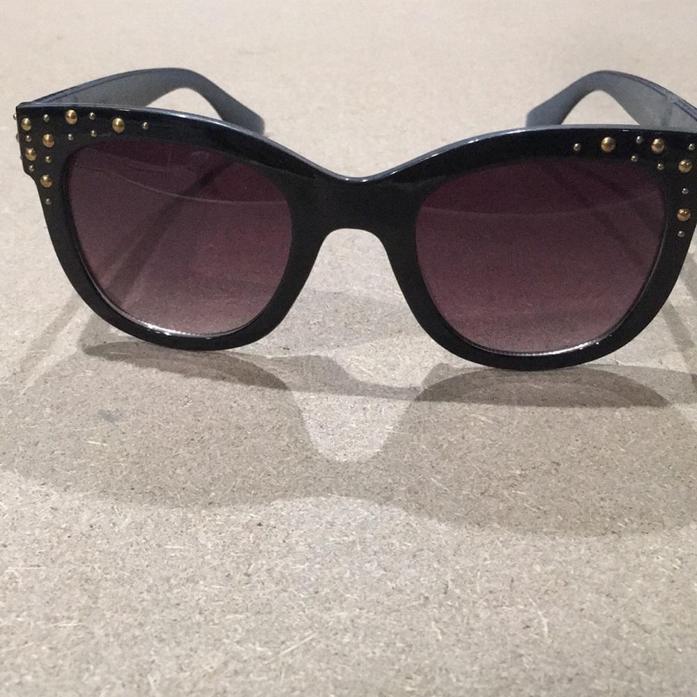 Black sunglesses with gold colored gems